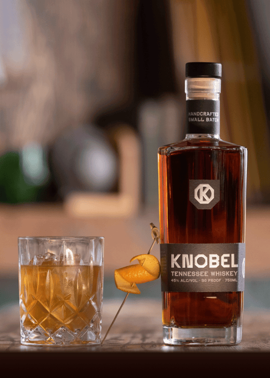 Knobel Tennessee Whiskey Bottle next to a craft drink